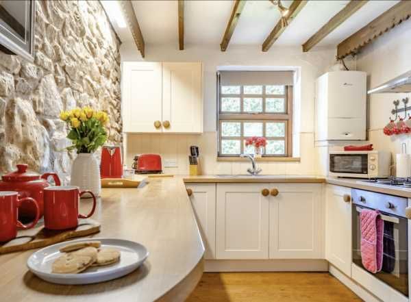 King Arthur's Gallery - modern kitchen with stone feature wall