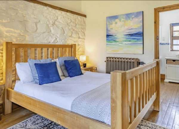 The Stable - accessible bedroom with wooden furniture